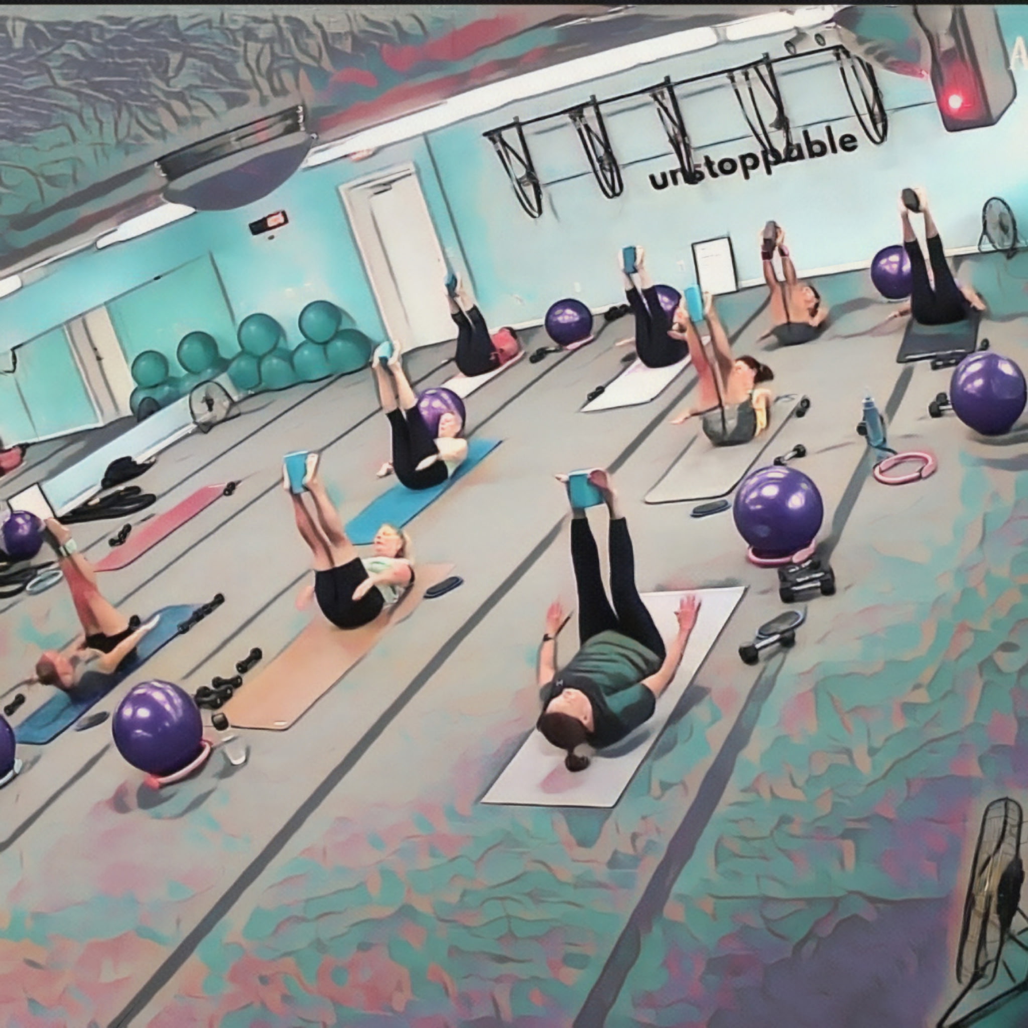 image shows yogis holding yoga blocks between their feet in upward stretches